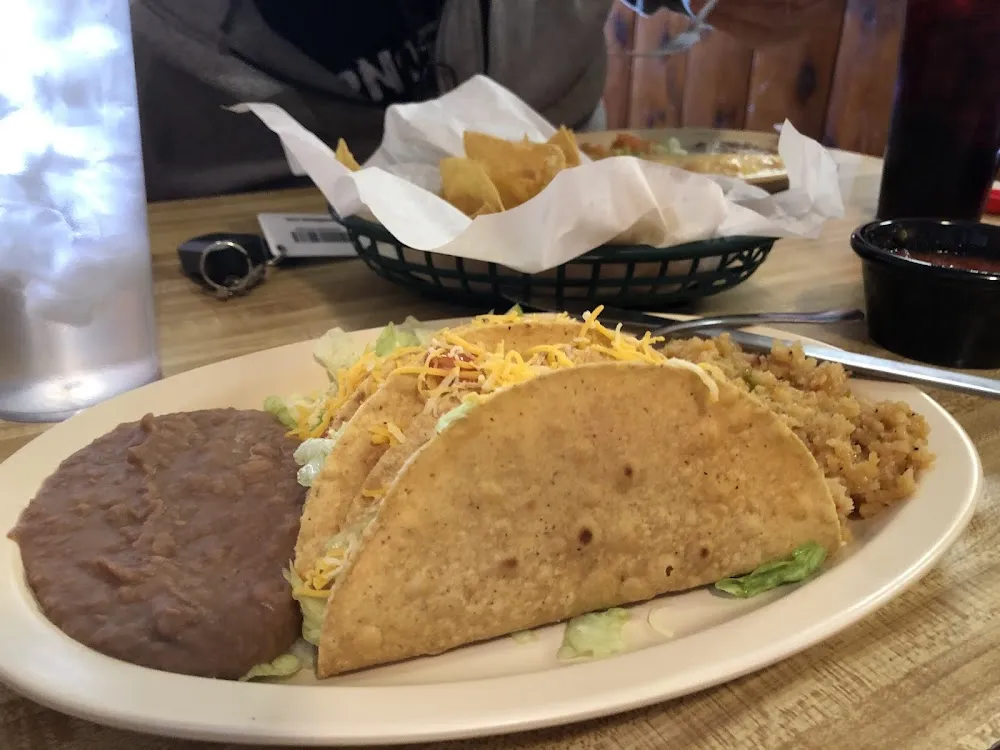 1 Taco or Enchilada with Rice and Beans